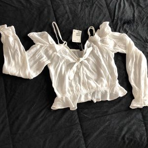 Shoulders off white top